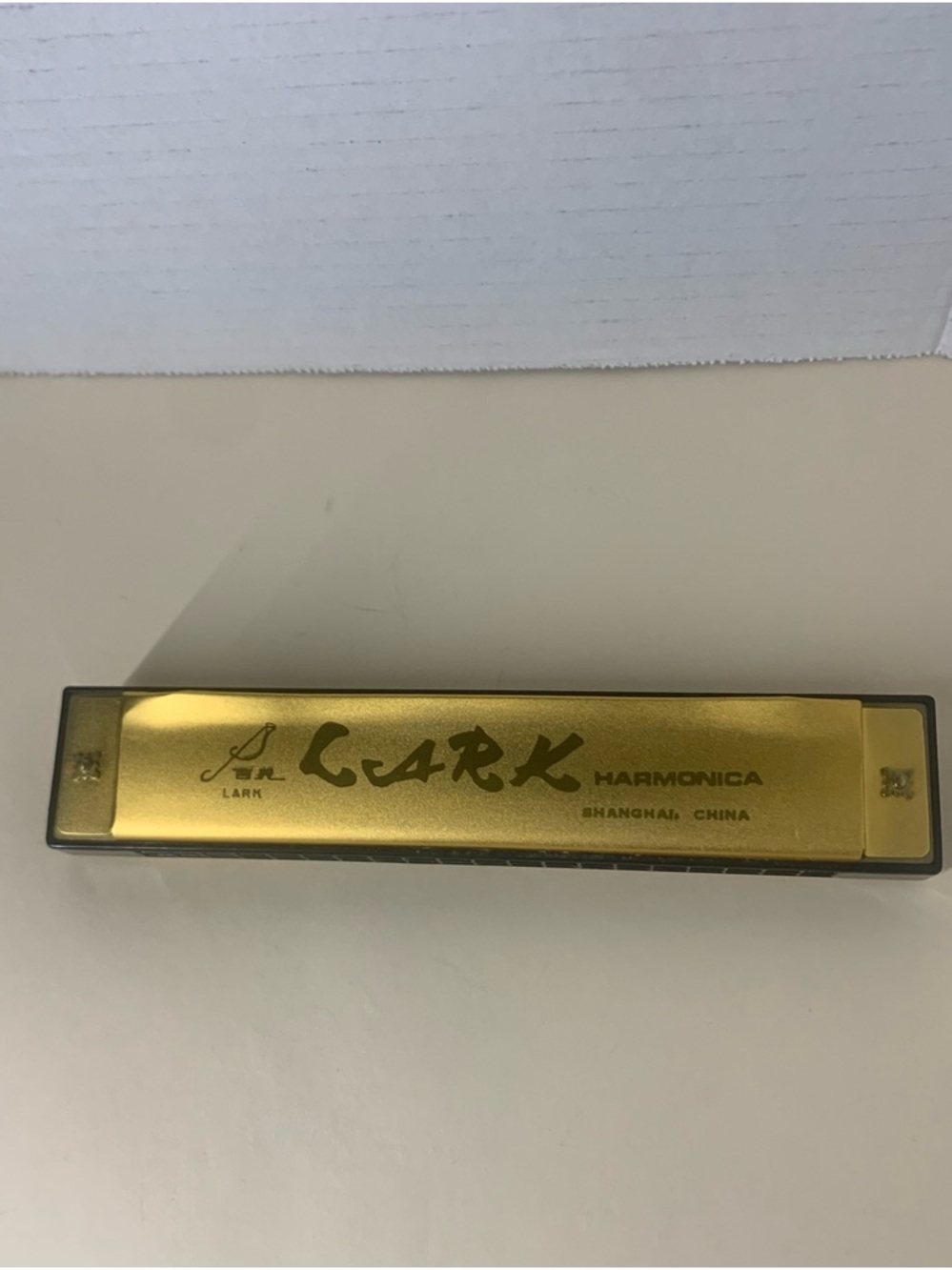 Cark Gold-Top Harmonica with Black Comb
